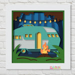 Layered scene made with cardstock.  Scene is of a vintage teal and white camper with a fire and string lights during Fall